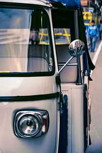 Close-up of vintage car parked on street