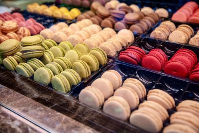 Various macaroons displayed for sale in store