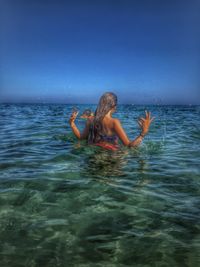 People swimming in sea