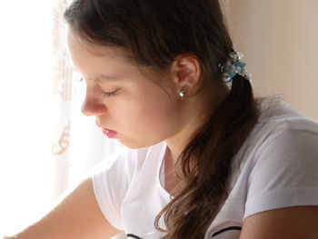 Close-up of beautiful woman at home