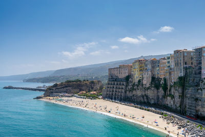 Panoramic view of city on the rock and sea against sky