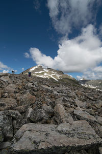 Scenic view of mountains against cloudy sky