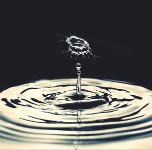 Close-up of water splashing on black background