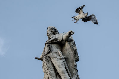 Low angle view of statue against clear sky