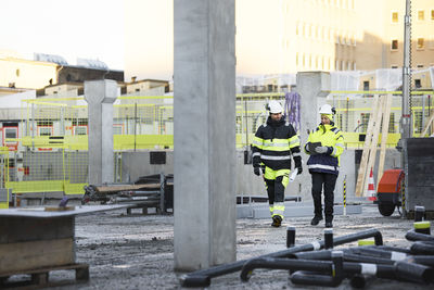 Construction engineers working at construction site