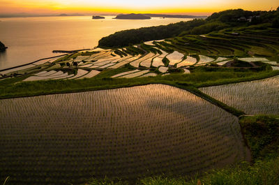 Scenic view of doya rice terrace against sky during sunset