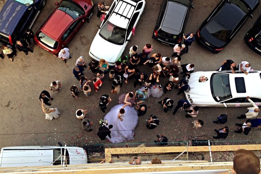 HIGH ANGLE VIEW OF PEOPLE ON ROAD