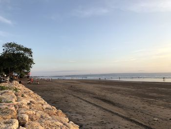 Scenic view of beach against sky during sunset