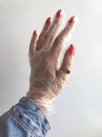 Close-up of hands over white background