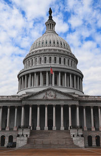 Low angle view of historical building against cloudy sky