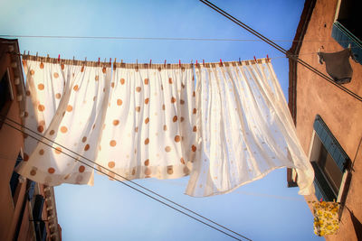 Low angle view of laundry hanging outdoors