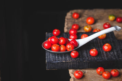 Close-up of cherry tomatoes against black background