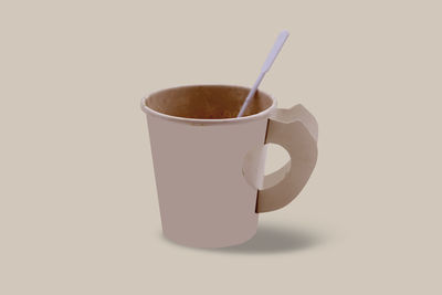 Close-up of coffee cup against white background