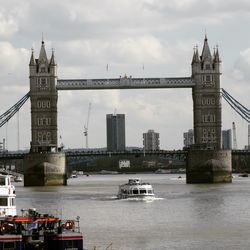 Bridge over river with city in background