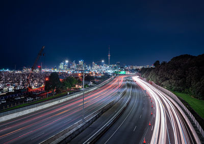 High angle view of light trails on road at night