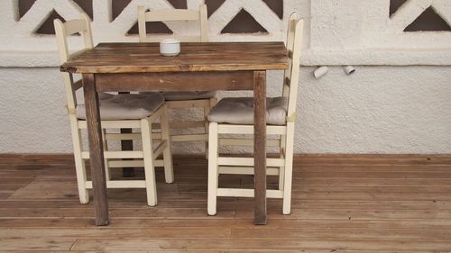 Wooden table and chairs on hardwood floor