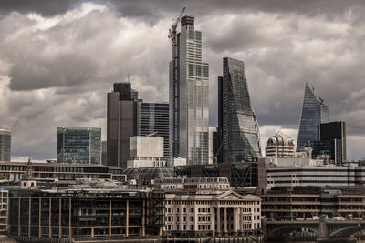 Modern buildings in city against sky