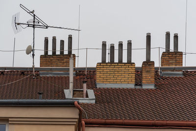 Houses against sky in city