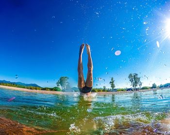 Diving in baikal lake overlooking the shore