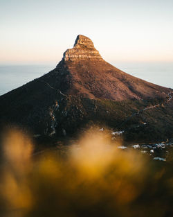 Scenic view of mountain against sky during sunset