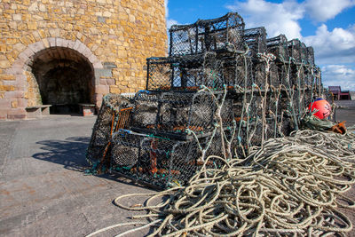 Stack of fishing net against built structure