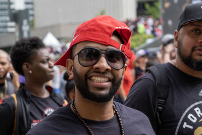 Portrait of smiling young man wearing hat