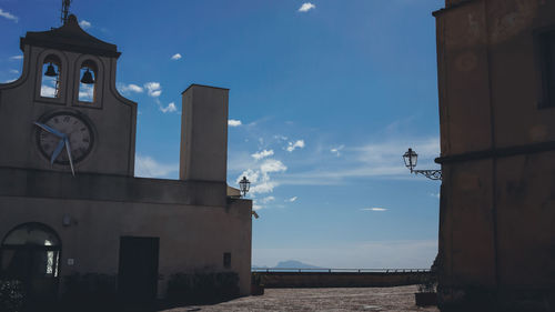 Low angle view of bell tower against sky