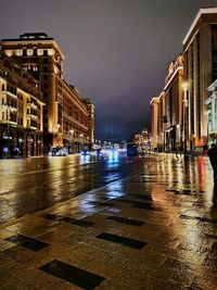 Wet city street during rainy season at night