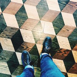 Low section of woman standing on tiled floor