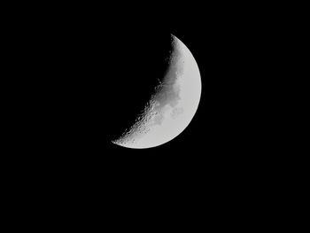 Low angle view of moon against clear sky at night