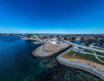 High angle view of sea against clear blue sky