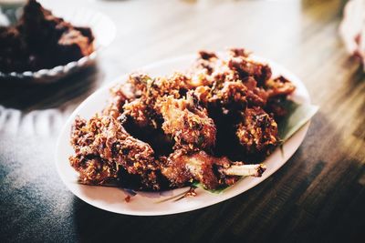 High angle view of meat in plate on table