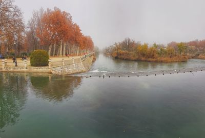 Scenic view of lake against sky during autumn