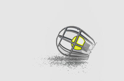 Close-up of yellow object over white background