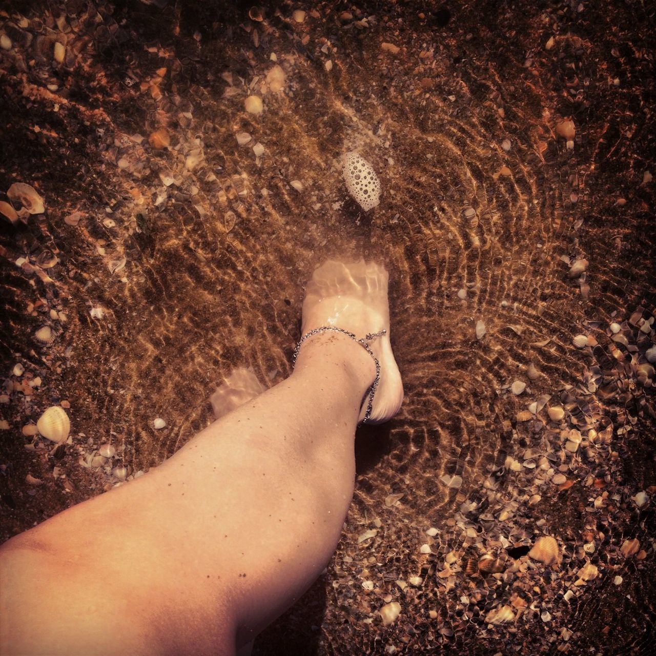 low section, person, personal perspective, barefoot, beach, lifestyles, sand, leisure activity, high angle view, human foot, sunlight, part of, relaxation, day, outdoors, shore