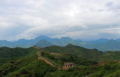 Scenic view of mountain against cloudy sky