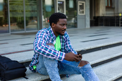 Young man using mobile phone