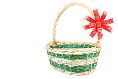 Close-up of wicker basket on white background