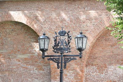 View of street light on brick wall