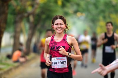 Portrait of a young woman running outdoors