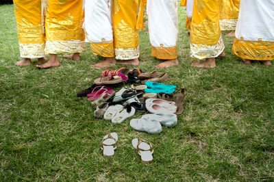 Low section of women standing on field