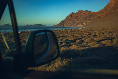 Reflection of road against sky during sunset