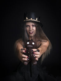 Portrait of young woman using mobile phone
