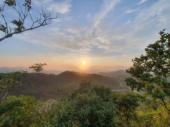 Scenic view of landscape against sky during sunset