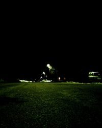 View of grassy field at night