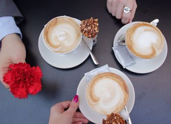 People having cup of coffee in cafe