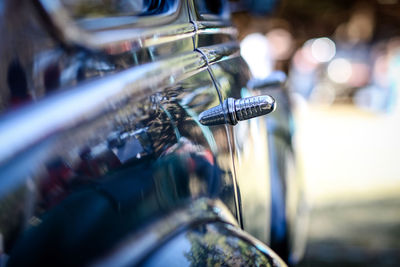 Close-up of bicycle on street