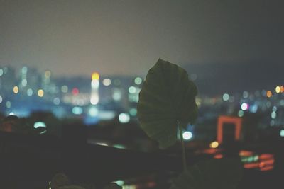 Defocused image of illuminated city at night