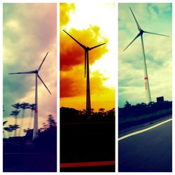 Wind turbines on landscape at sunset