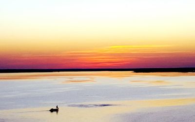 Scenic view of sea at sunset